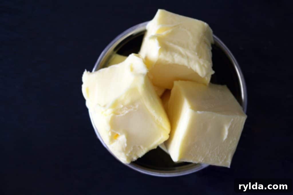 Softened butter, crucial for the best cake and frosting texture.