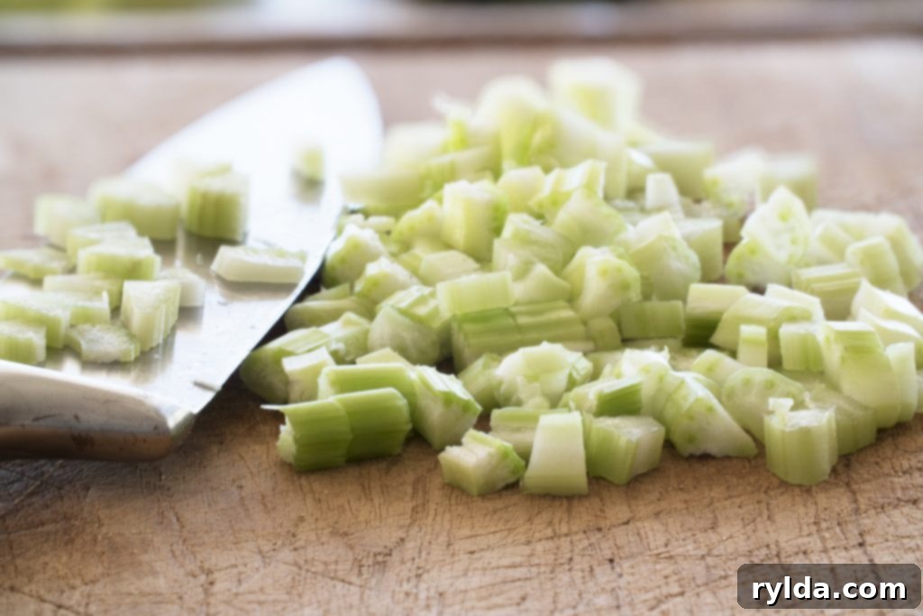 Freshly diced celery, ready to add aromatic flavor to homemade stuffing.