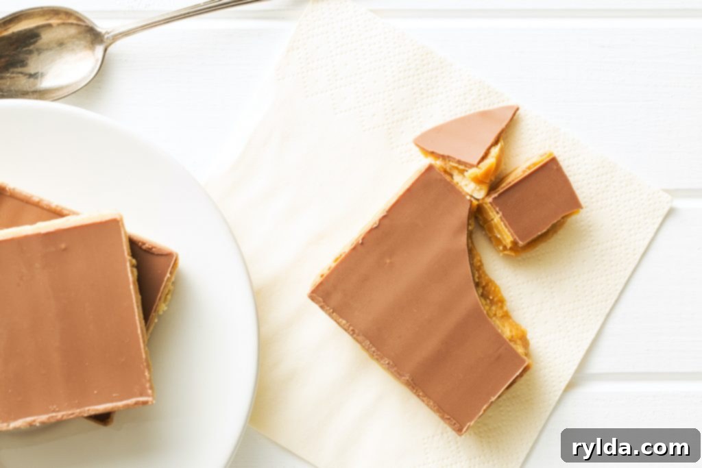 Decadent Triple-Layer Millionaire Bars 4 Perfectly portioned Millionaire Shortbread Bar, showcasing its delightful layers