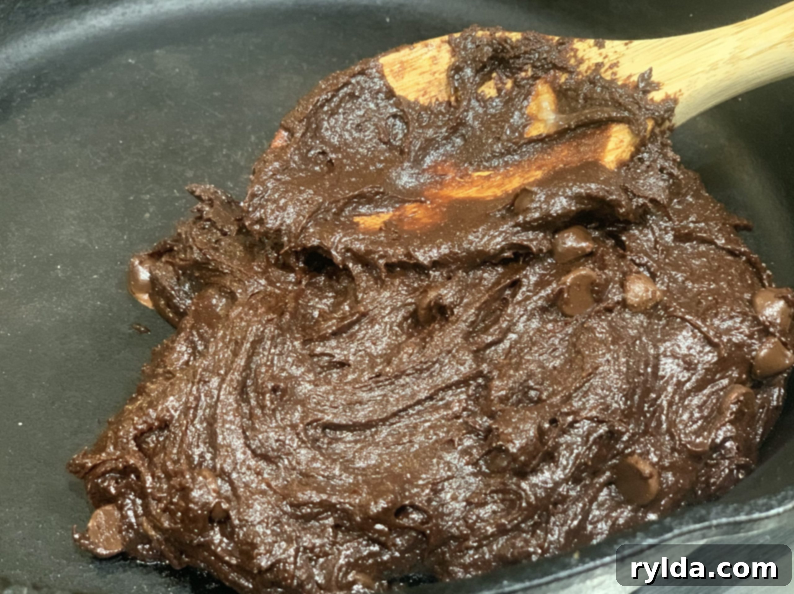 Delicious fudgy brownies sliced into triangles and topped with powdered sugar