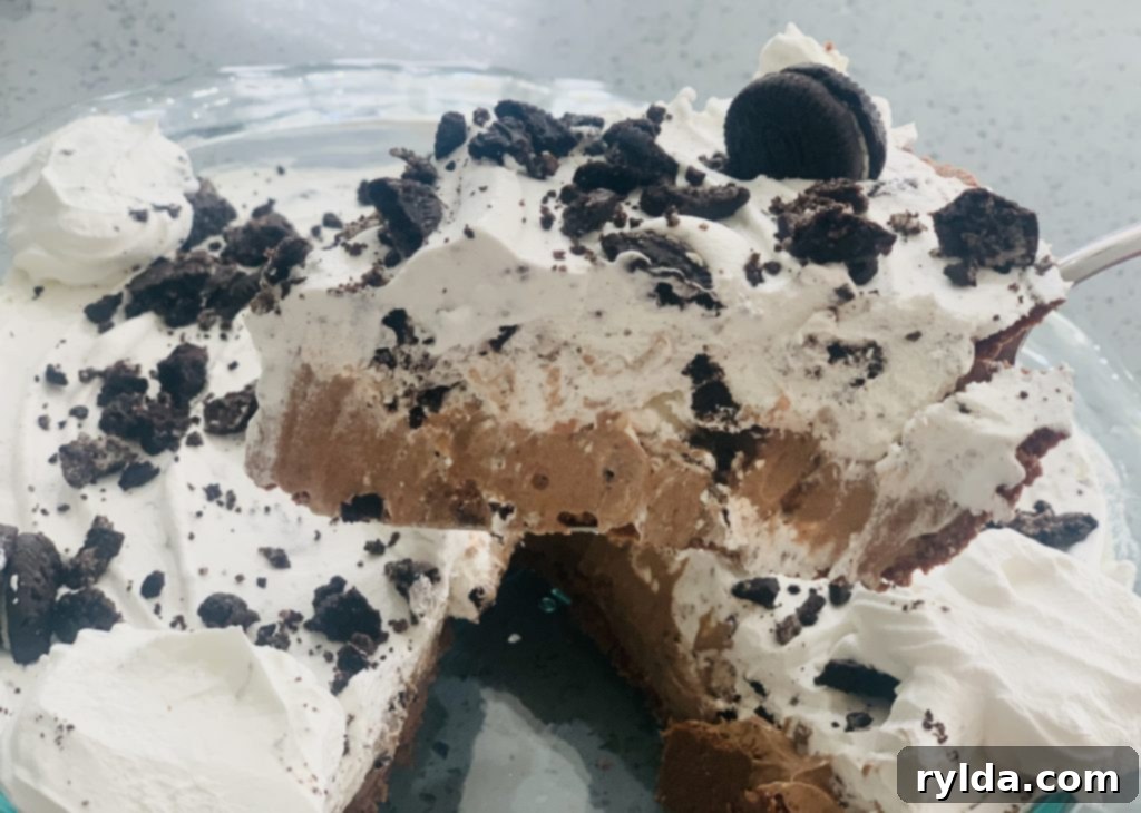 Decadent No-Bake Oreo Chocolate Delight 5 Perfectly set No-Bake Oreo Chocolate Pie, ready to be served.