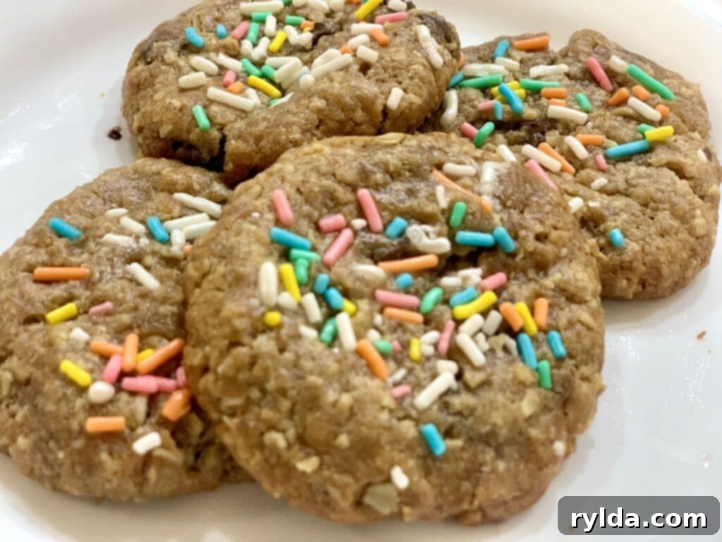 Freshly baked pastel sprinkle chocolate chip cookies on a cooling rack