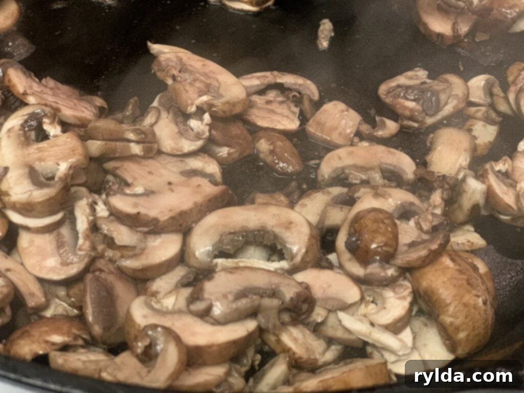 Tender Pan-Seared Filet Mignon with Savory Mushrooms 6 Fresh, sliced baby bella mushrooms, ready to be sautéed and infused with red wine.