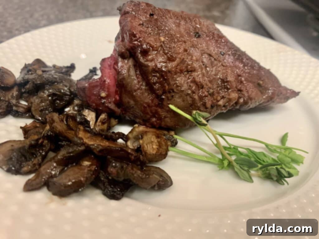 Tender Pan-Seared Filet Mignon with Savory Mushrooms 8 A close-up of the completed Pan-Seared Filet Mignon with Mushrooms, showcasing the perfect sear and tender interior.