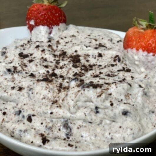 A delicious bowl of creamy Oreo Dip, garnished with extra crushed Oreos, ready to be served.