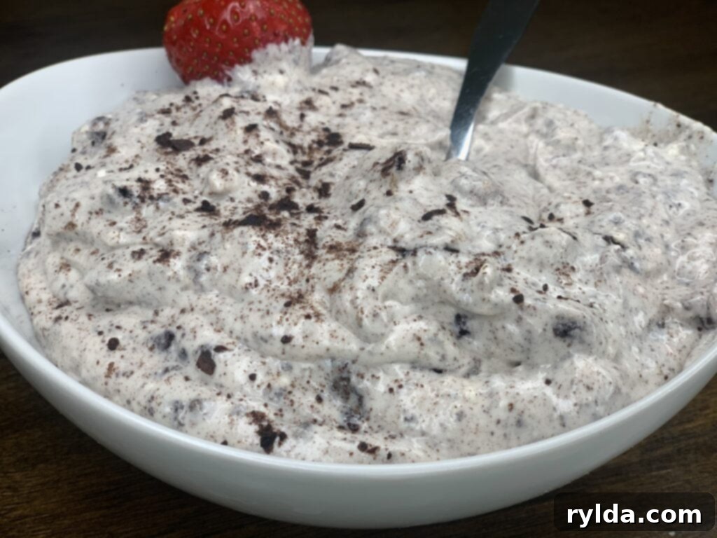 A beautifully presented bowl of Oreo Dip, garnished with extra Oreos, ready for a party.