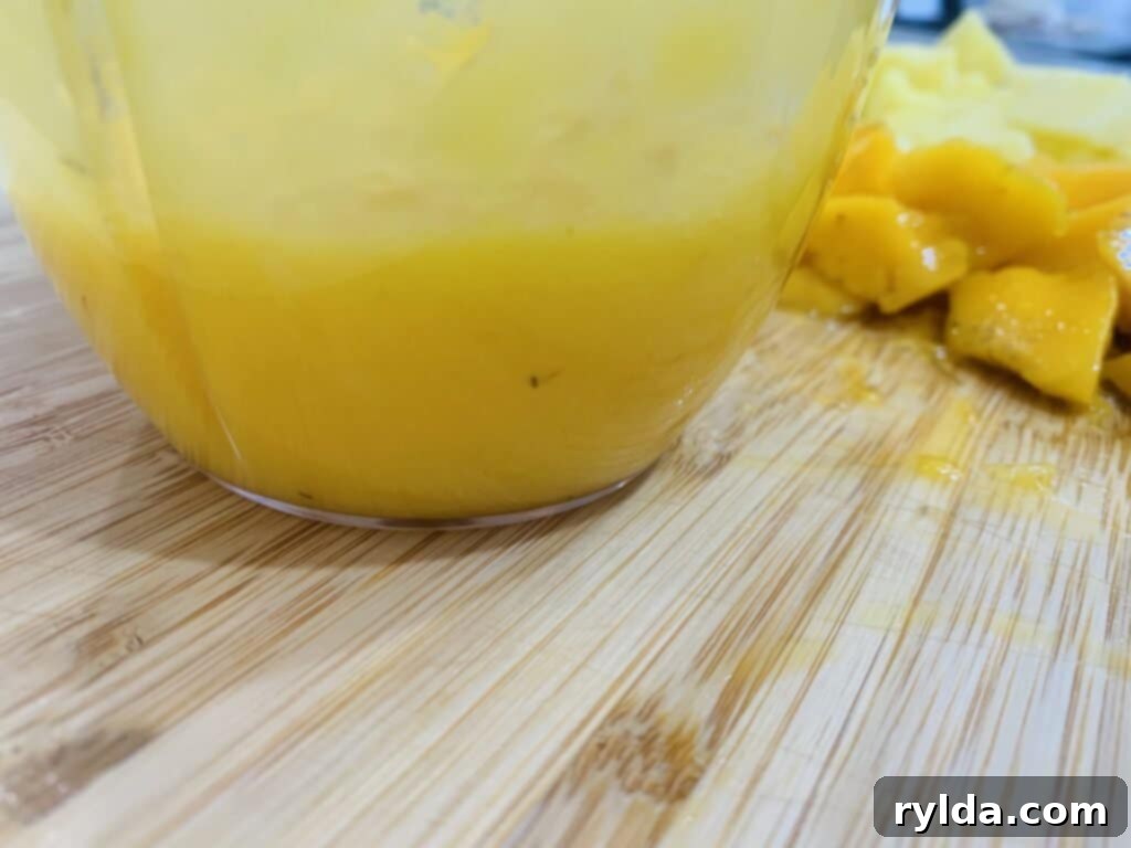 Popsicle molds filled with fruit mixture