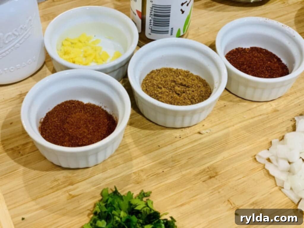 Fresh ingredients for Chana Masala, including chickpeas, spices, and tomato.
