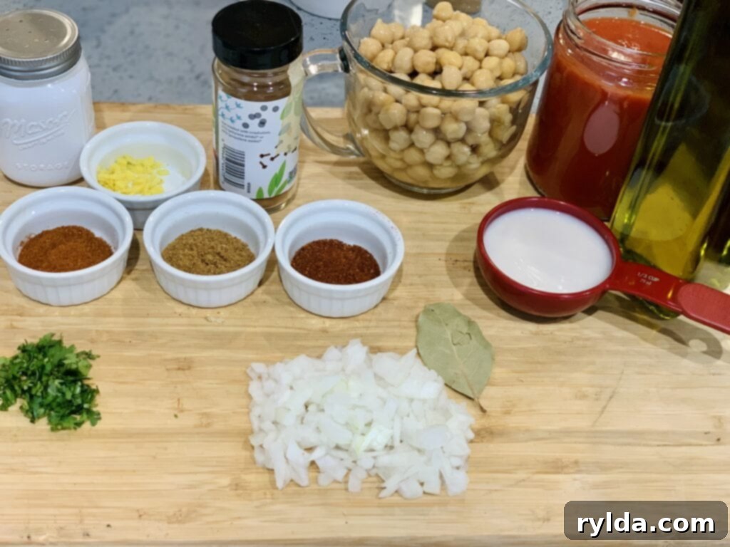Variety of Indian spices used for Chana Masala, including chili powder, garam masala, and cinnamon.