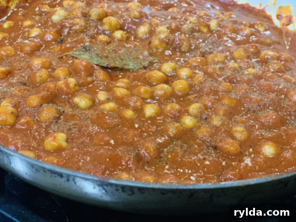 Close-up of freshly cooked Chana Masala, garnished with cilantro, ready to be served.