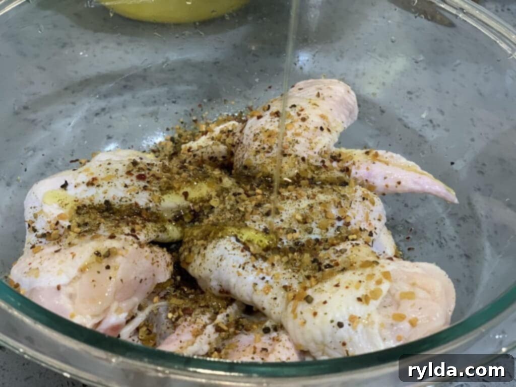 Seasoned chicken wings ready for baking