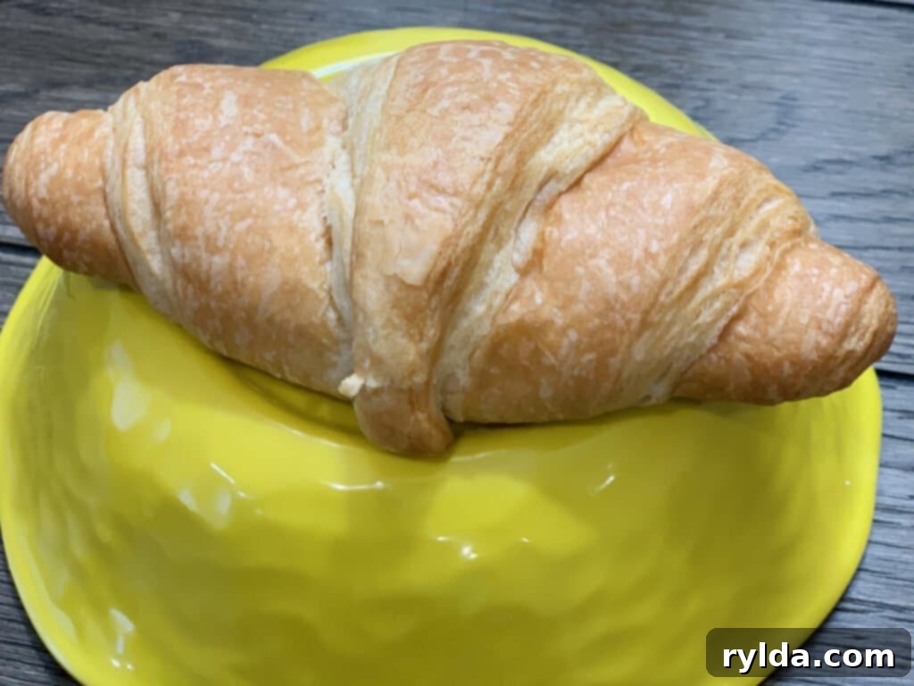 Crispy bacon and fluffy eggs, ready to be assembled into a delicious breakfast croissant.