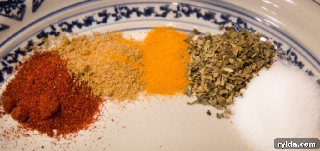 Assortment of vibrant herbs and spices in bowls