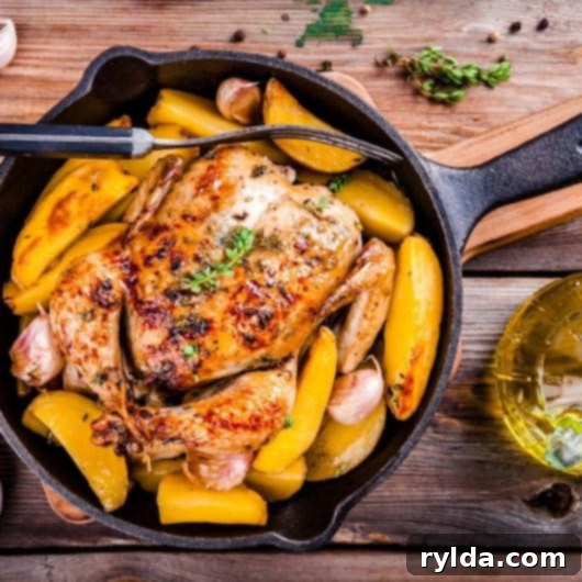 Juicy Roasted Chicken with Dry Rub, served with roasted potatoes and fresh herbs on a rustic wooden board, ready for a comforting family dinner.
