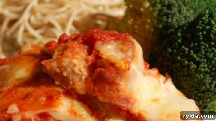Classic Chicken Parmigiana with golden-brown crust and melted cheese